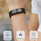 Fitnessniches Smart Bracelet with LED digital display showing time and fitness tracking features on a wrist.
