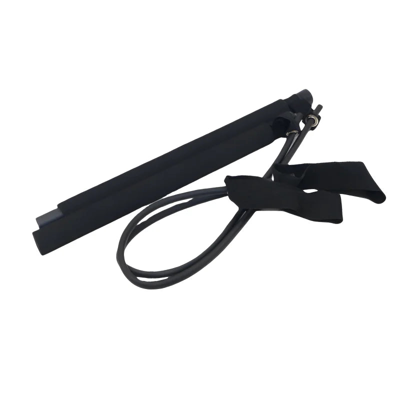 Portable Fitnessniches Yoga Pilates bar with resistance bands, set up in a home workout space.